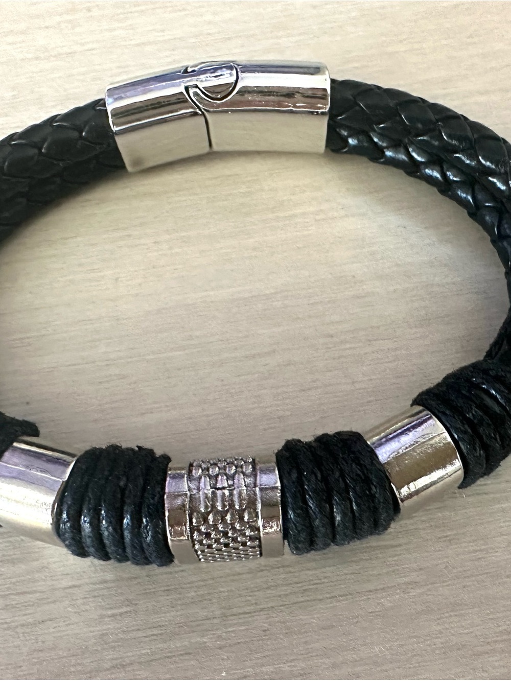Men’s Black Braided Leather and Silver Accent Bracelet.